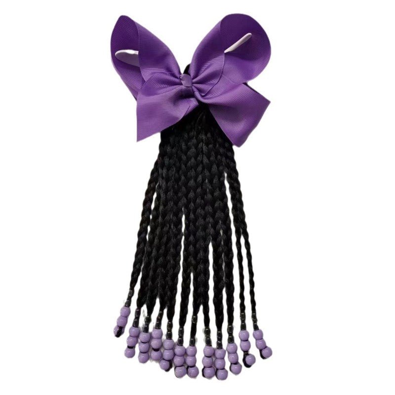 Elastique queue de cheval tressée pour fillette sur les cheveux de fillette violet